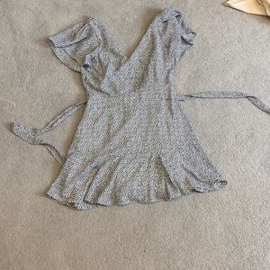 Polka dot black and white dress with a white underdress.